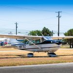 1963 Cessna 205 N8170Z right side profile in white with black and gold striping