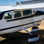 Cessna 205 N8170Z left side showing the six place cabin windows and high wing