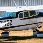 Cessna 205 N8170Z right side beside the hangar at Georgetown Municipal Airport