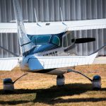 Cessna 205 N8170Z head on front view showing propeller, cowling and wing