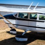 Cessna 205 N8170Z left side close view of the cabin, wing strut and landing gear
