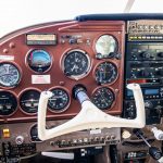 Cessna 205 N8170Z pilot side instrument panel with flight instruments and yoke