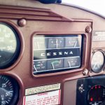 Cessna 205 N8170Z engine instruments and original Cessna panel badge
