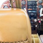 Cessna 205 N8170Z pilot seat with the instrument panel beyond