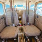 1963 Cessna 205 N8170Z middle row cabin seating with inertial reel shoulder harnesses