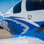 Rear quarter view of 2015 Cessna TTx N576DC showing the tail and fuselage striping