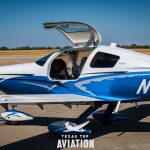 Side view of 2015 Cessna TTx N576DC with the cabin door open