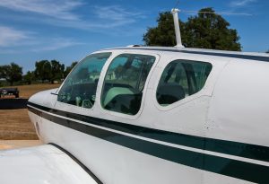 Cabin windows and green stripe on N474Z