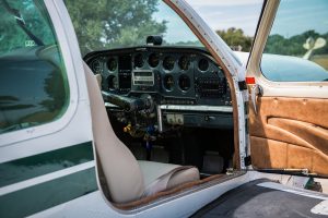 Open cabin door showing the instrument panel of N474Z