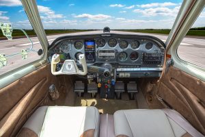 Cockpit and instrument panel of N474Z, a 1957 Beechcraft H35 Bonanza, with Garmin avionics and leather interior