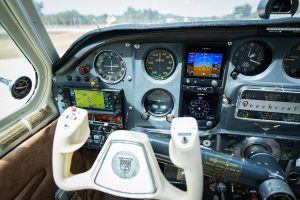 Left side of the N474Z instrument panel with Garmin GTN 650, G5 displays and pilot yoke