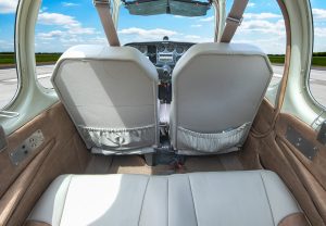 Cabin and front seats of N474Z, a 1957 Beechcraft H35 Bonanza, viewed from the rear