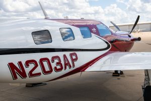 Piper Meridian PA46-500TP N203AP right side fuselage with registration