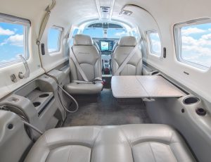 Piper Meridian PA46-500TP N203AP cabin looking forward with the table deployed